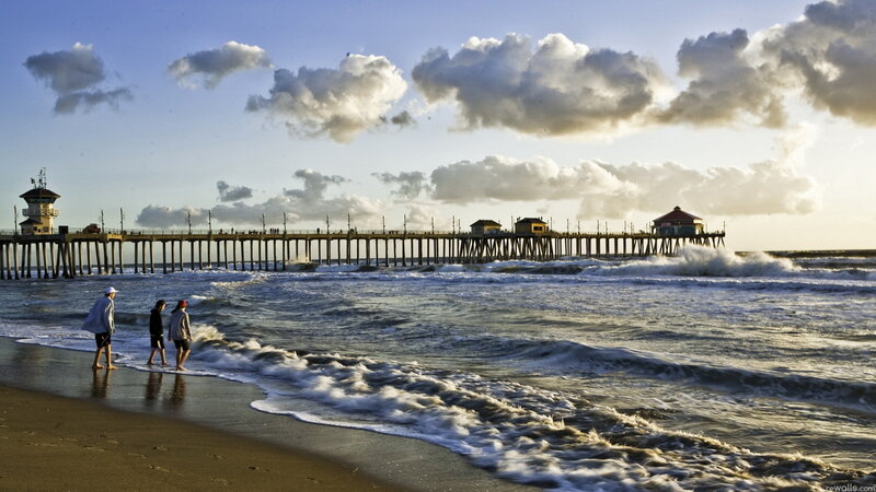 People on Beach Near Pier