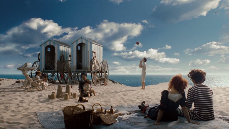 People on Beach with Huts