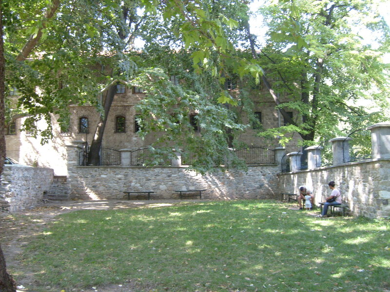 People on Benches in Park