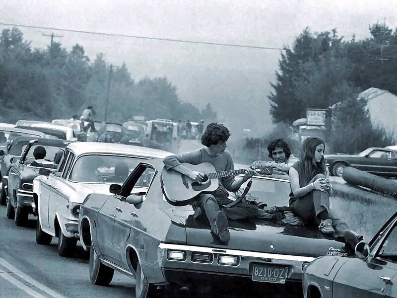 People on car roofs at traffic jam