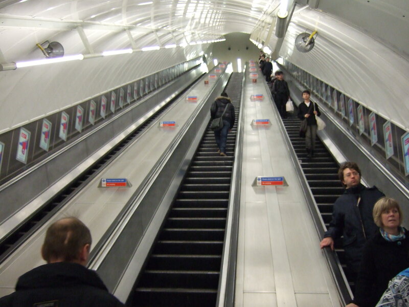 People on escalators in subway
