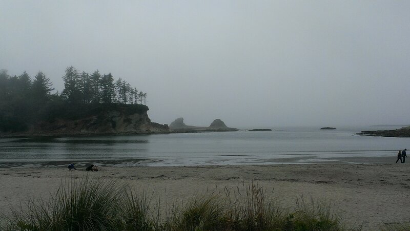 People on Foggy Beach