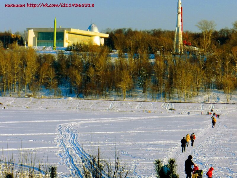 People on frozen lake with rocket