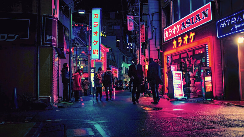 People on Neon-lit Street