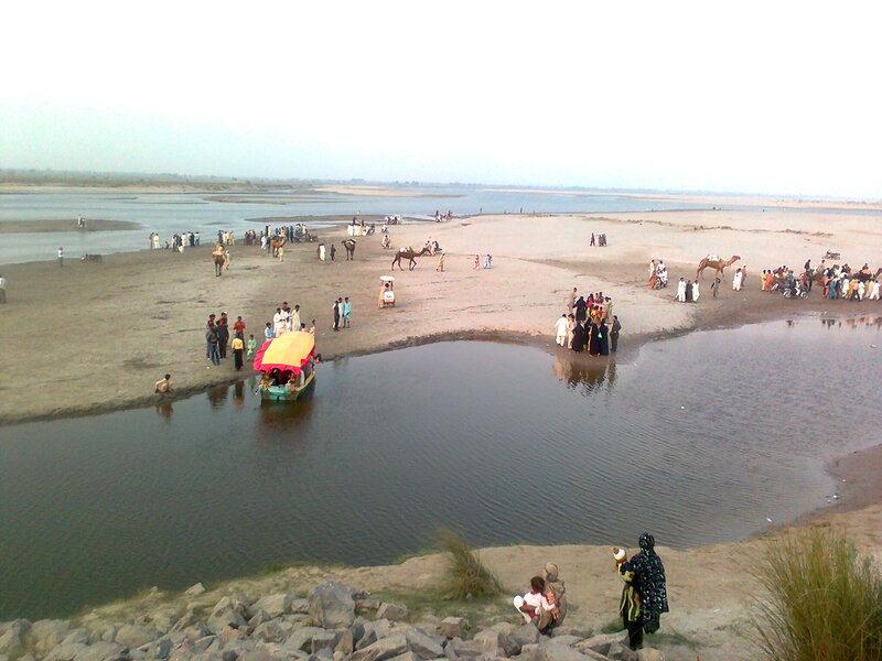 People on Riverbank — Brown