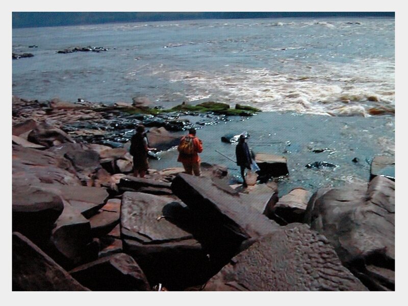 People on Rocky Shore — Gray, Dramatic