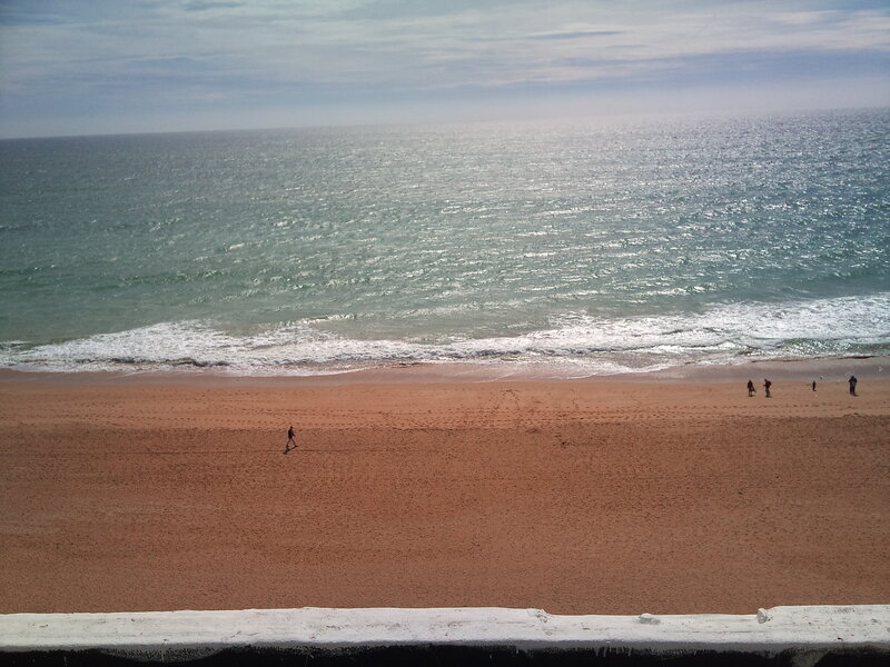 People on Sandy Beach — Brown, Calm