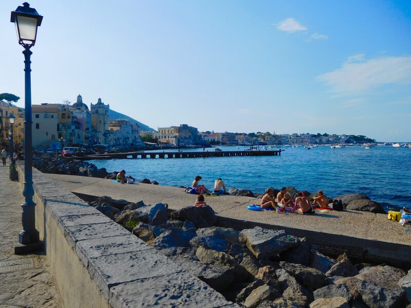 People on Seaside Wall