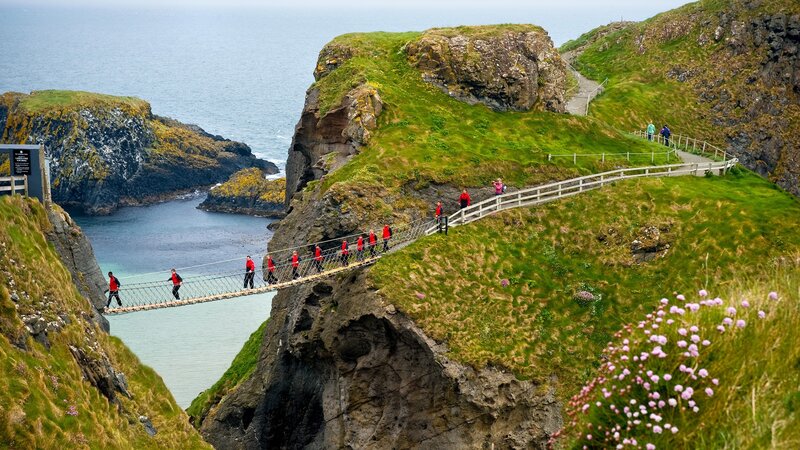 People on Suspension Bridge — Green, Dramatic