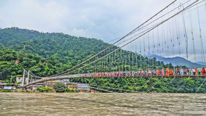 People on Suspension Bridge — Green