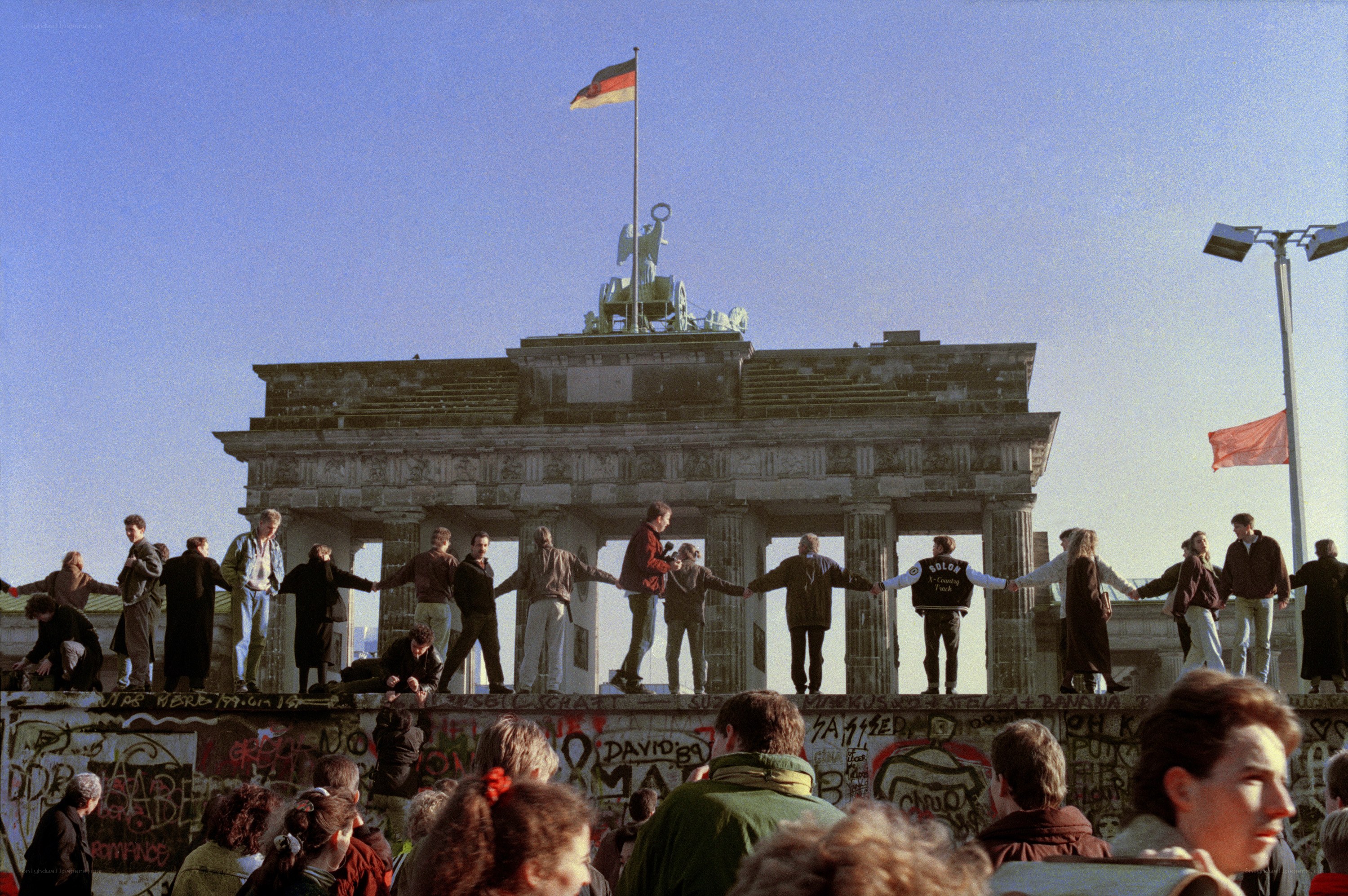 People on the Berlin Wall