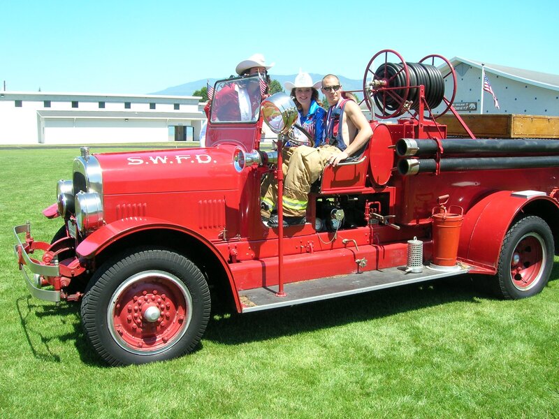 People on vintage fire truck