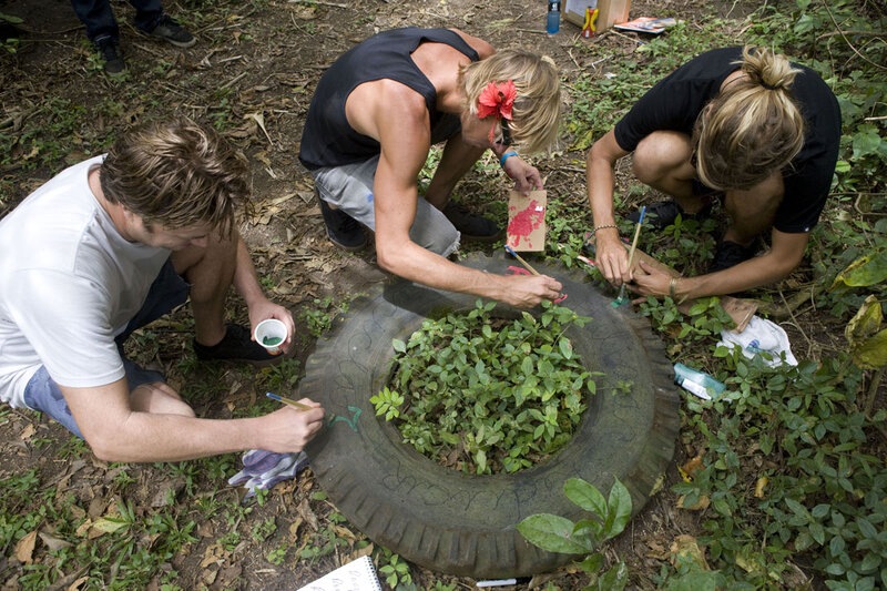 People Painting Tire Planter