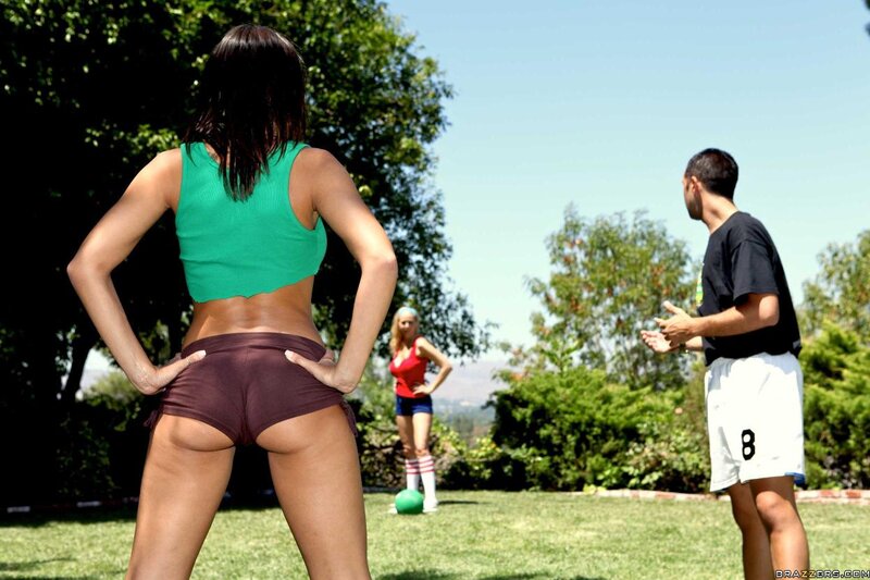 People playing ball in a yard