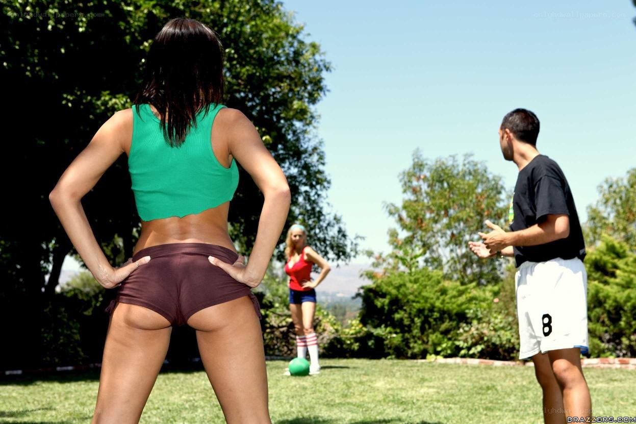 People playing ball in a yard