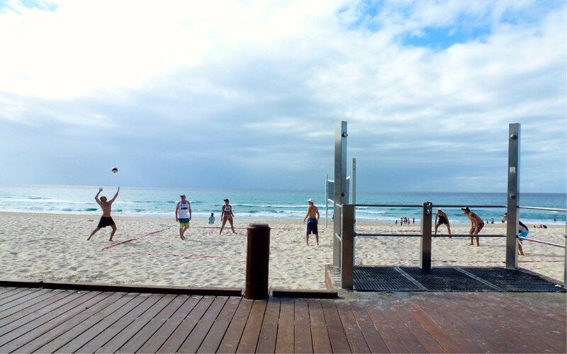 People Playing Beach Volleyball — Blue