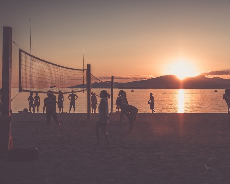People Playing Beach Volleyball — Orange