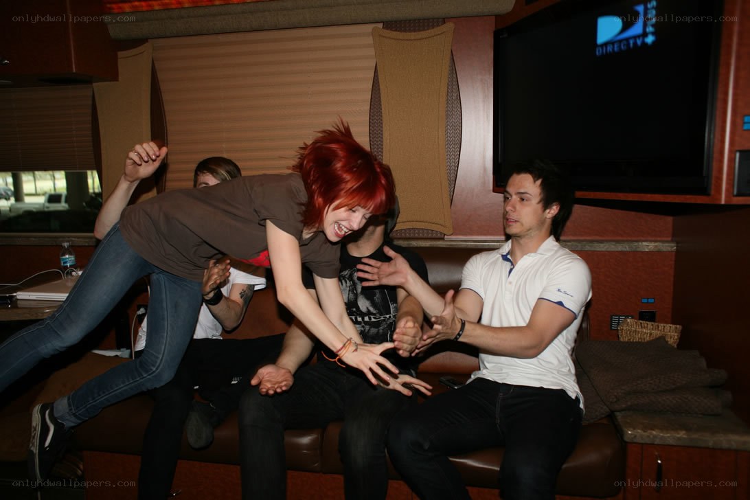People playing on a tour bus