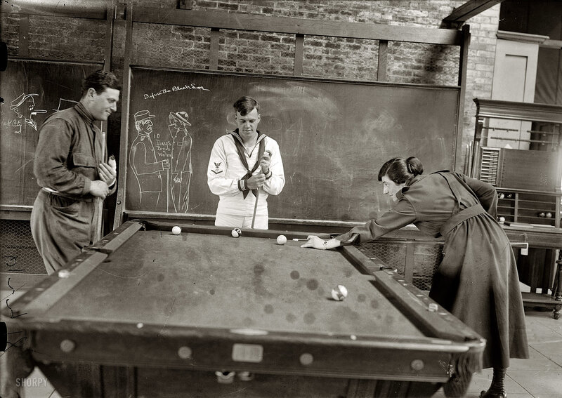 People playing pool in a room