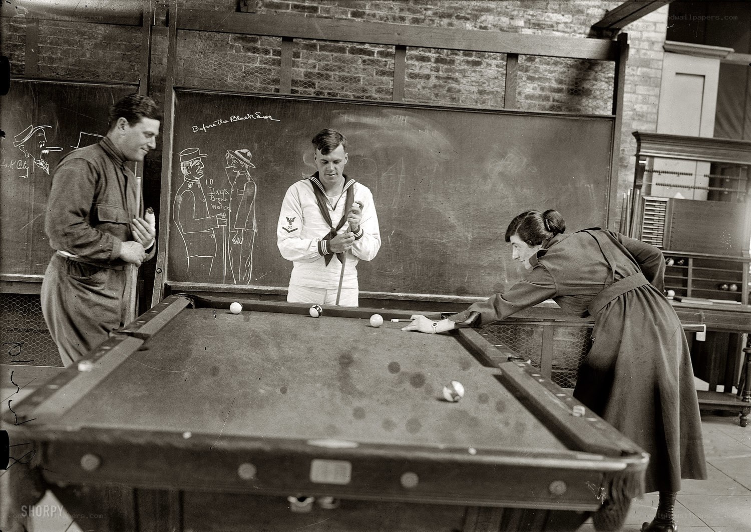 People playing pool in a room