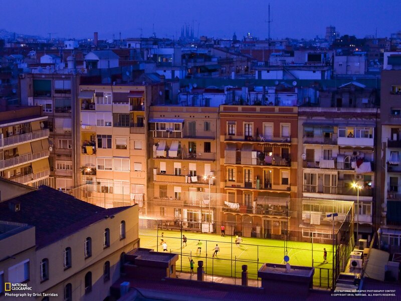People Playing Soccer at Night