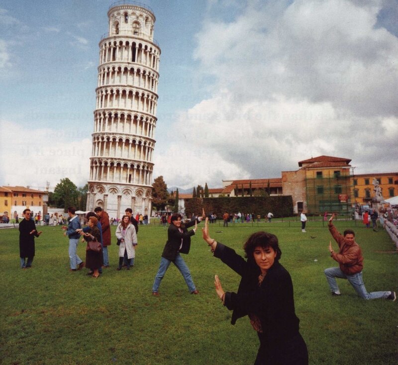People posing at Leaning Tower of Pisa