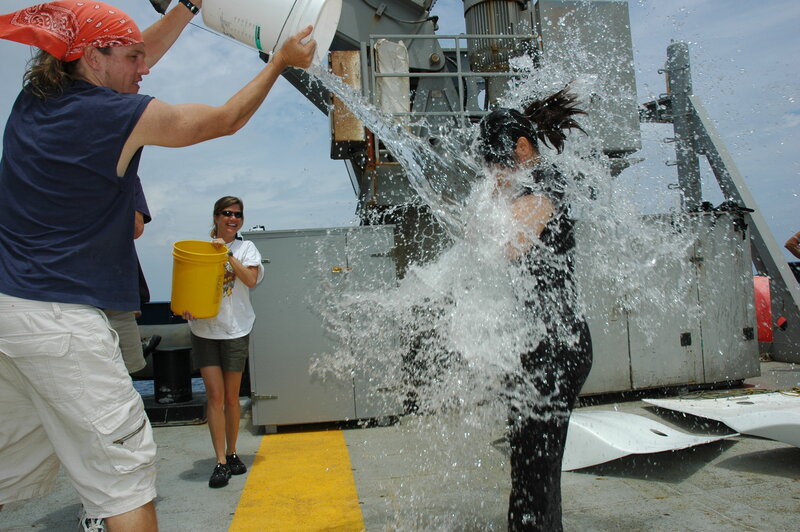 People pouring water on each other
