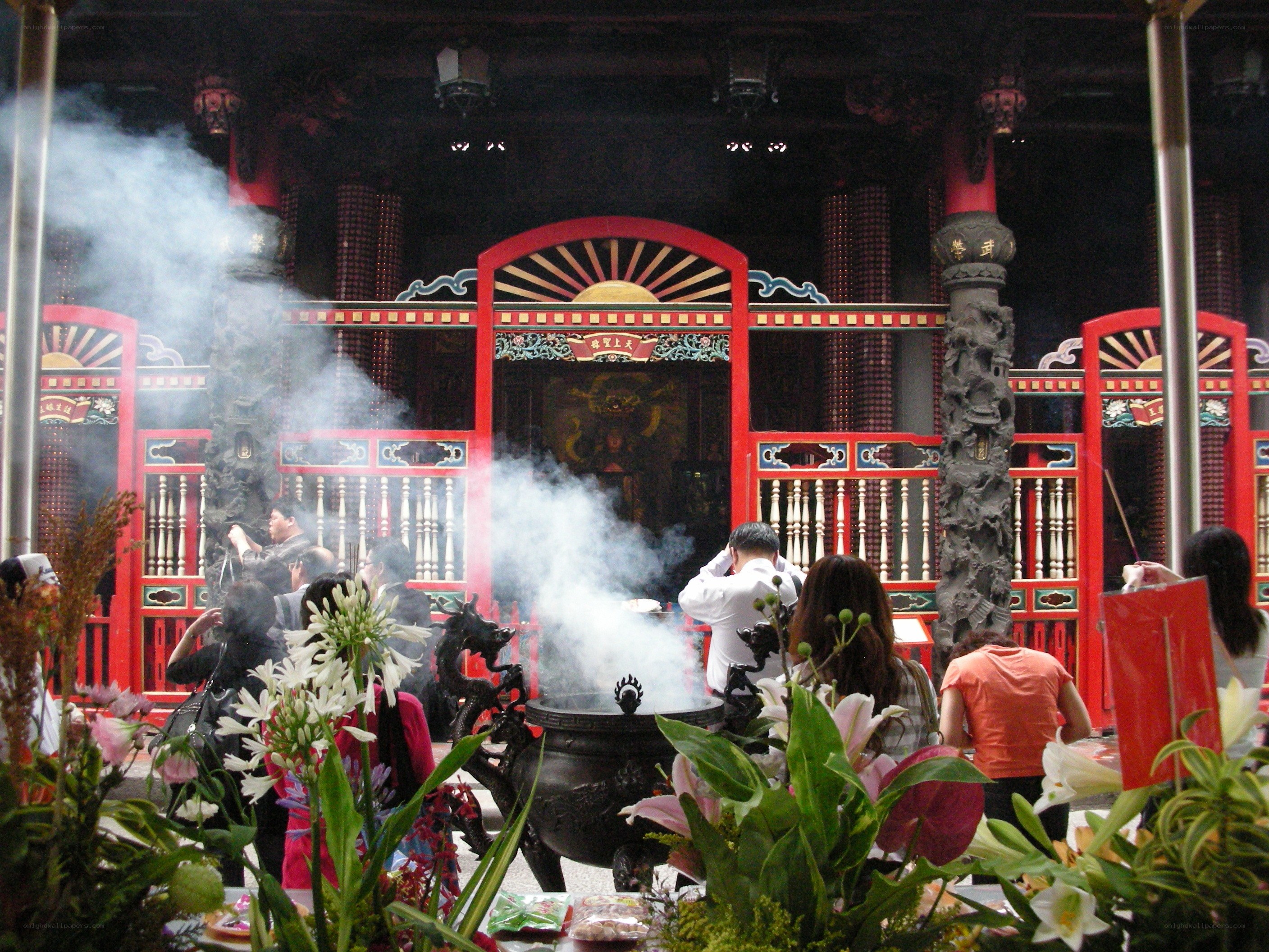 People praying at a temple