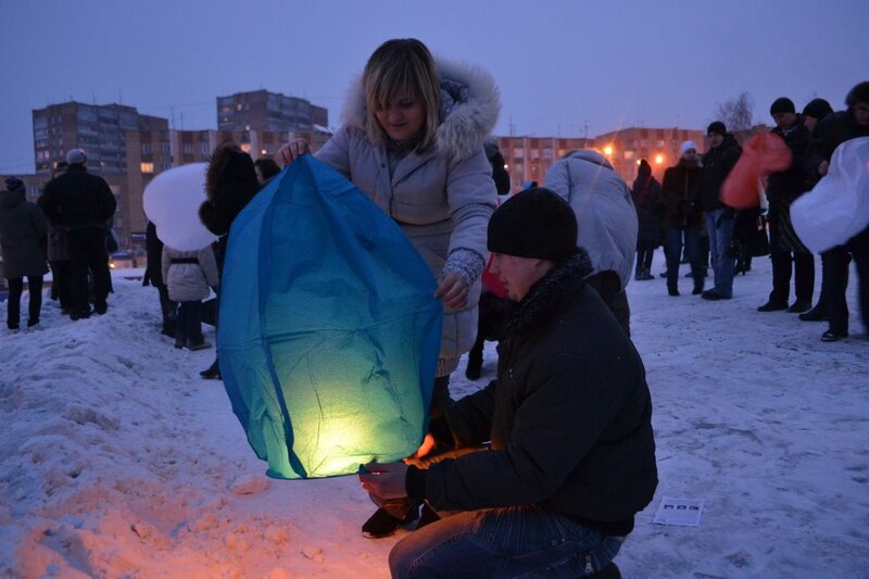 People preparing sky lanterns