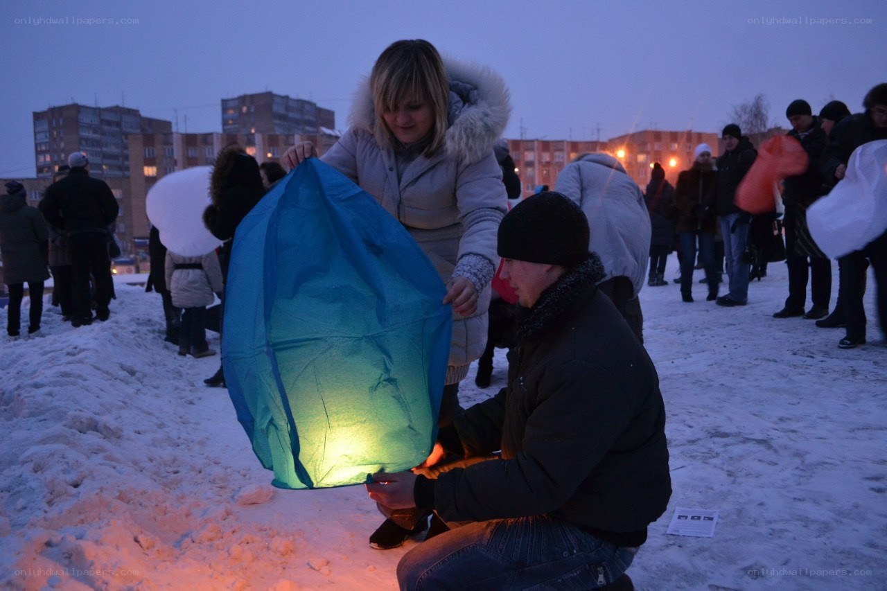 People preparing sky lanterns