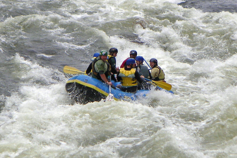 People Rafting in Rapids