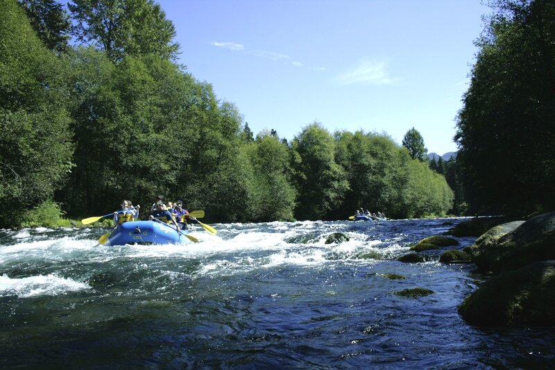 People Rafting on River — Blue
