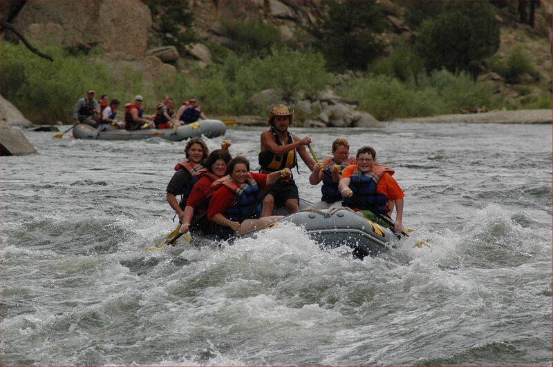 People Rafting on River — Gray