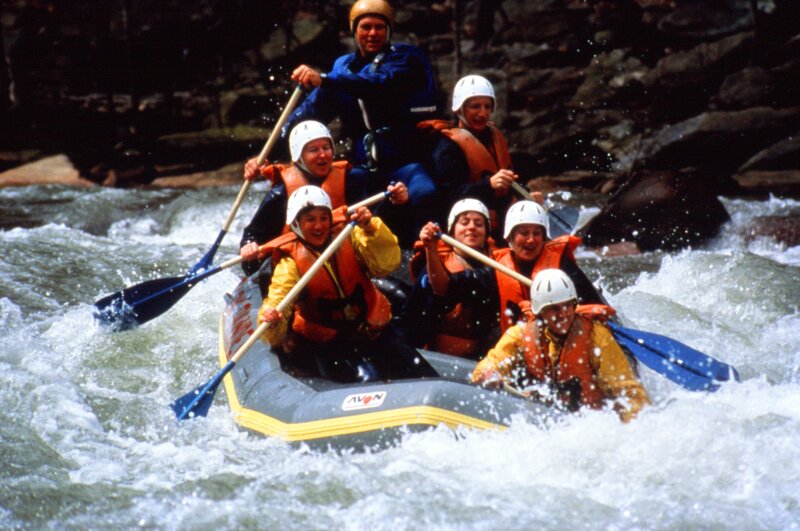 People Rafting on River — White
