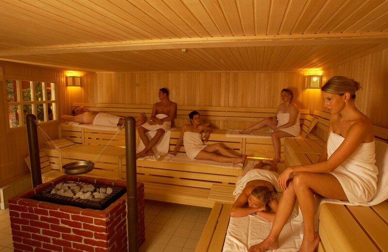 People relaxing in a sauna
