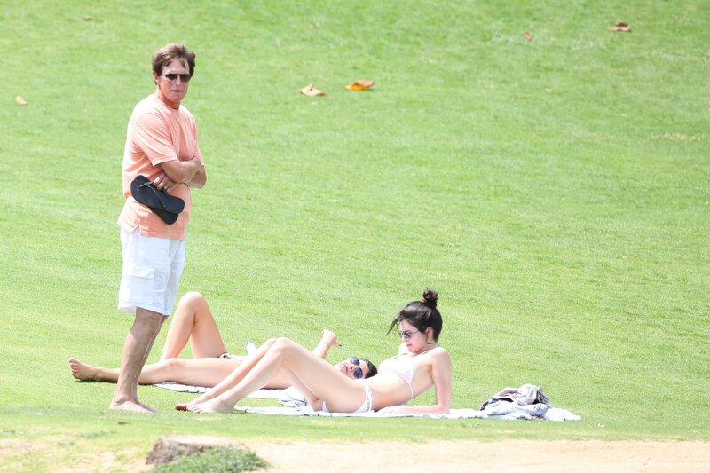 People relaxing on a grassy field