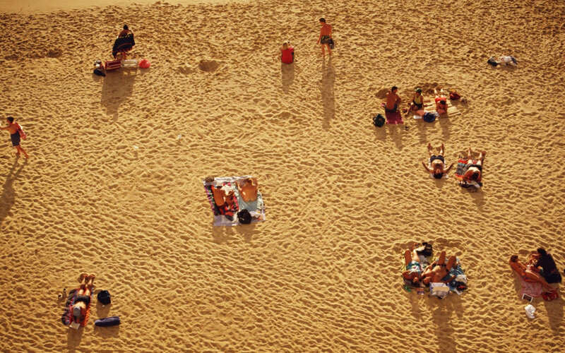 People relaxing on a sandy beach
