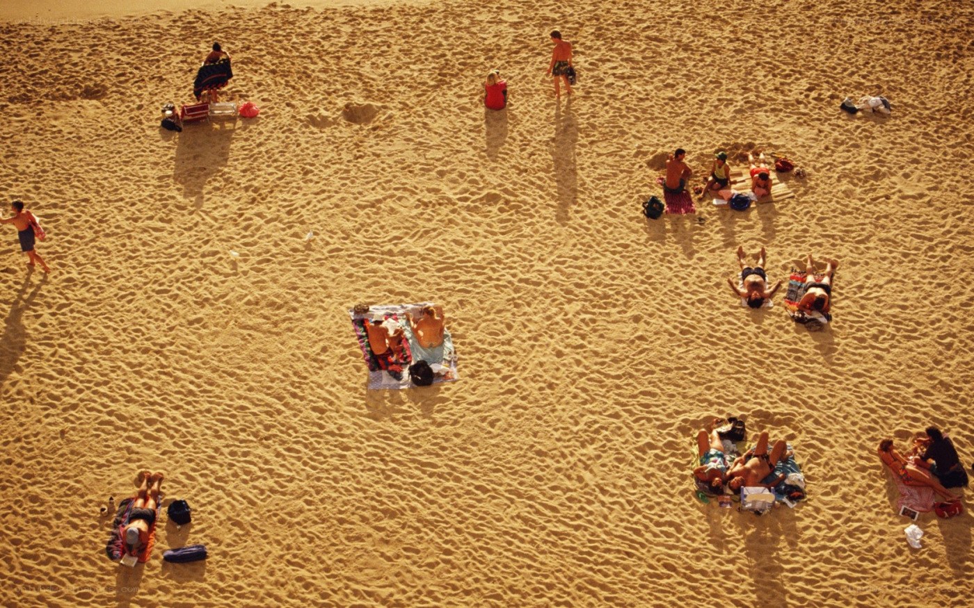 People relaxing on a sandy beach
