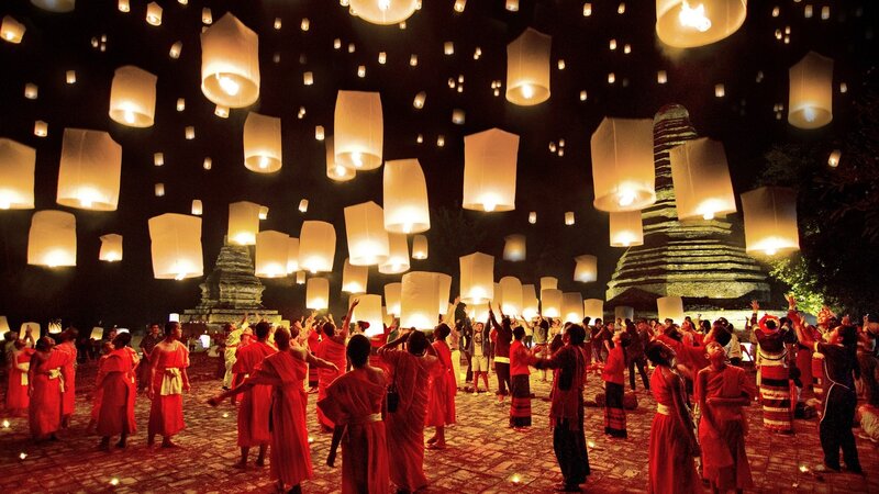 People Releasing Lanterns