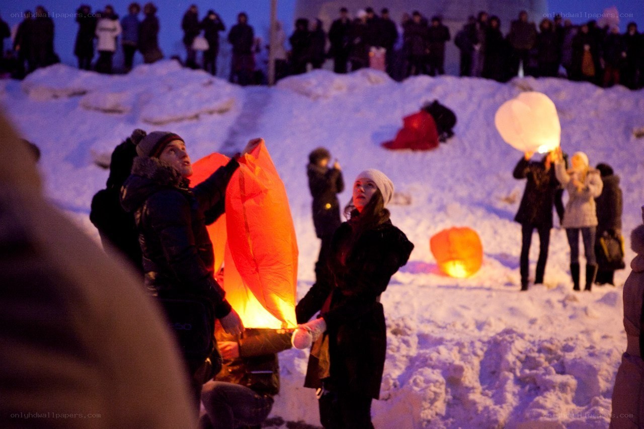 People releasing sky lanterns