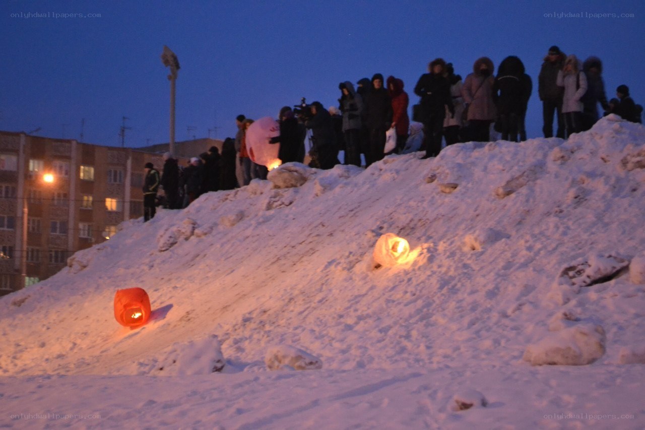 People releasing sky lanterns