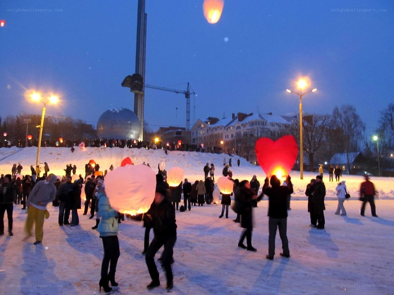 People releasing sky lanterns