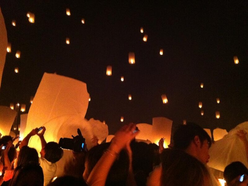 People Releasing Sky Lanterns — Black