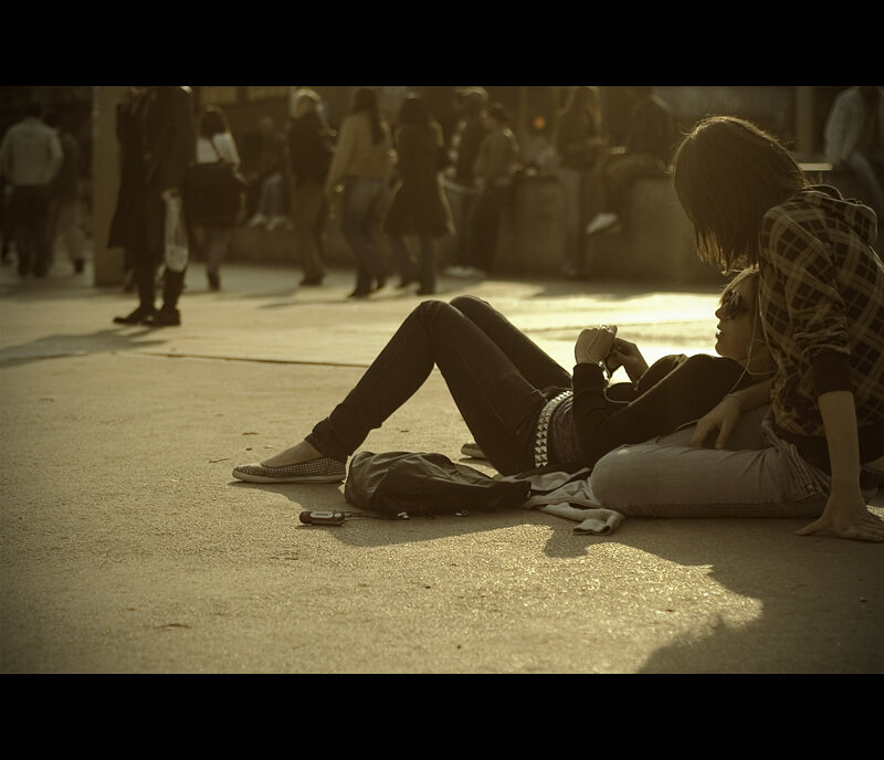 People resting on a city street