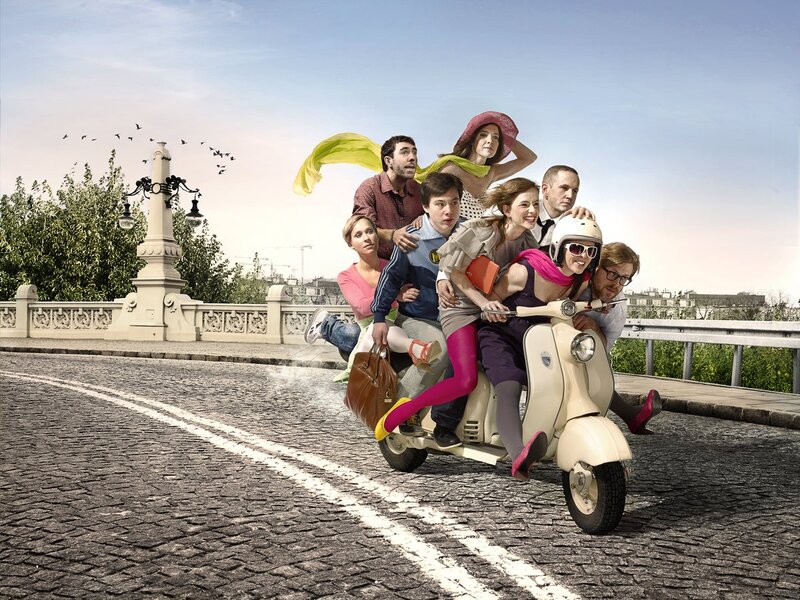 People riding a scooter