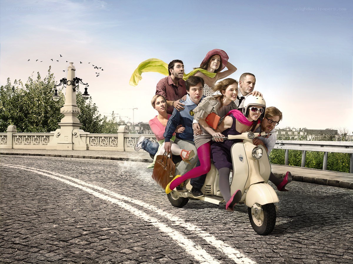 People riding a scooter