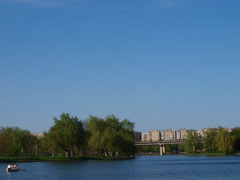 People rowing on a lake