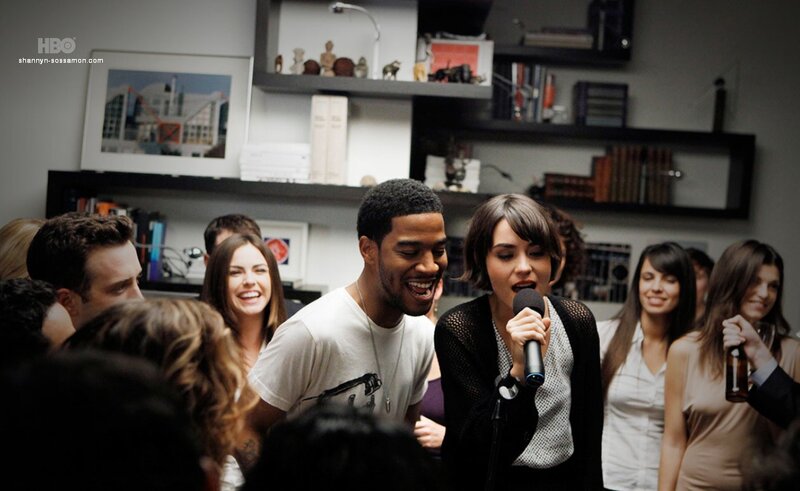 people singing karaoke at party