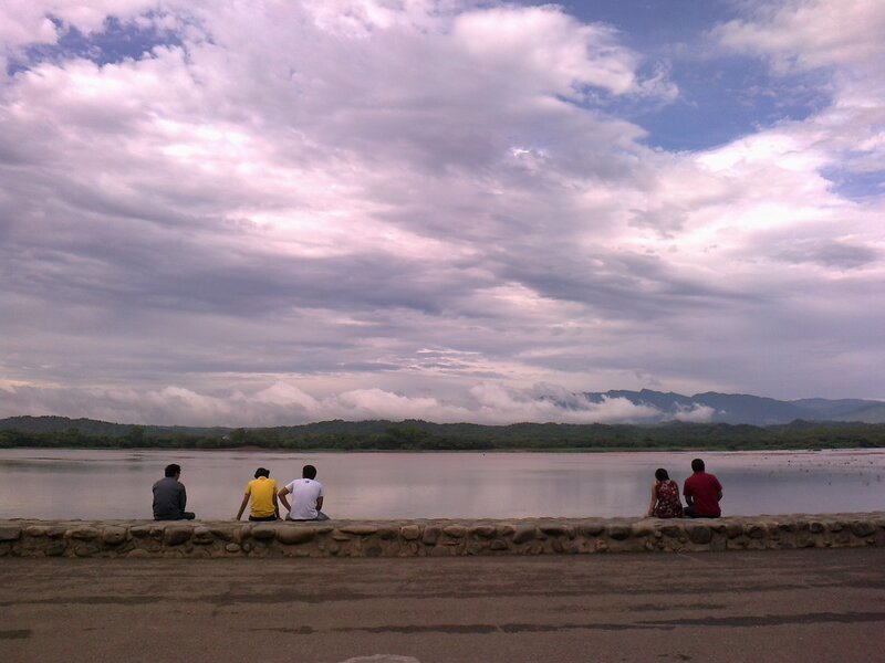 People Sitting by Lake