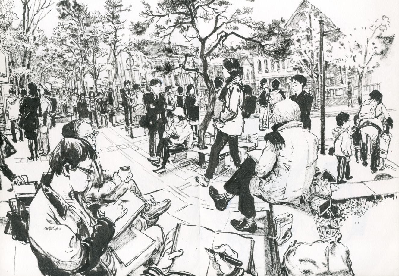 People sketching in a park